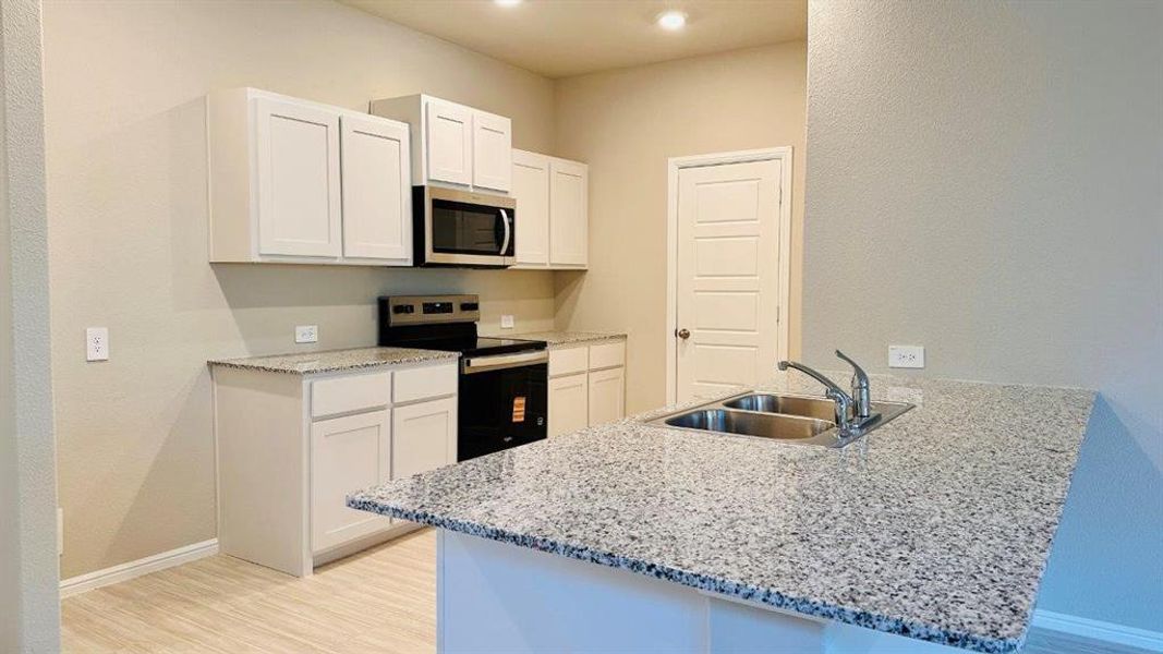 Kitchen - All Home and community information, including pricing, included features, terms, availability and amenities, are subject to change at any time without notice or obligation. All Drawings, pictures, photographs, video, square footages, floor plans, elevations, features, colors and sizes are approximate for illustration purposes only and will vary from the homes as built. Kitchen - All Home and community information, including pricing, included features, terms, availability and amenities, are subject to change at any time without notice or obligation. All Drawings, pictures, photographs, video, square footages, floor plans, elevations, features, colors and sizes are approximate for illustration purposes only and will vary from the homes as built.