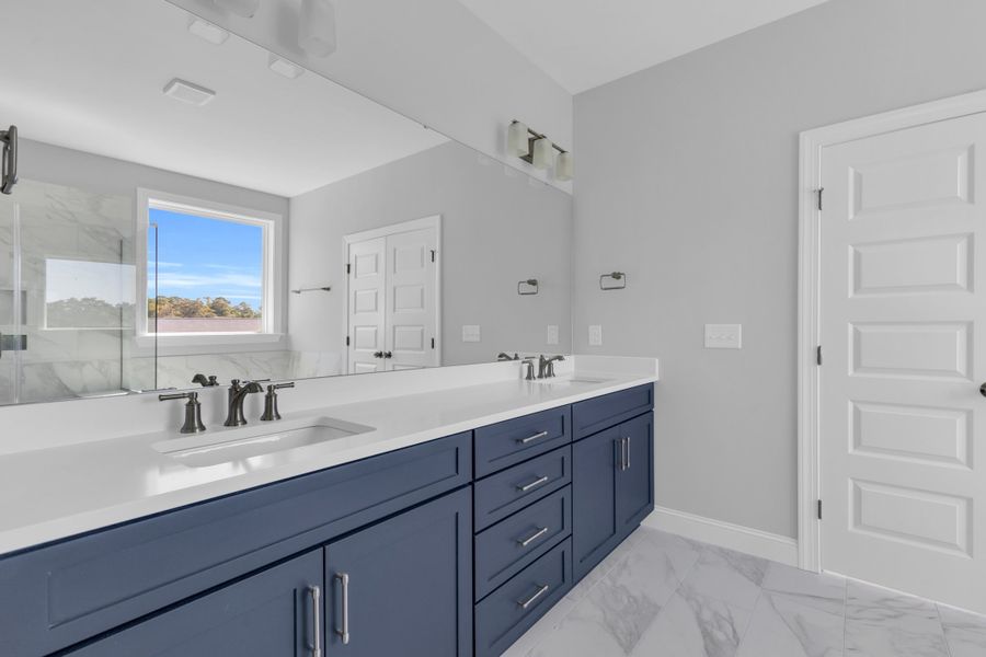 Representative furnished interior of a home built from the The Hampton by RobuckHomes in Windwater, Hampstead (Image 49).