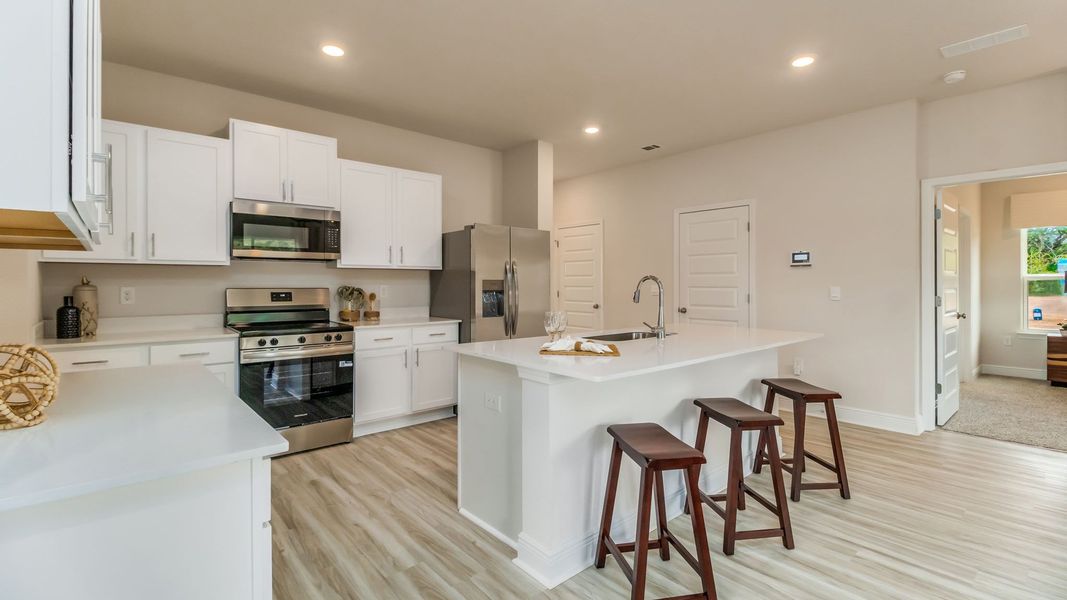 Furnished interior view inside a new home in Magnolia at the Bluffs Phase 3, Freeport (Image 9).