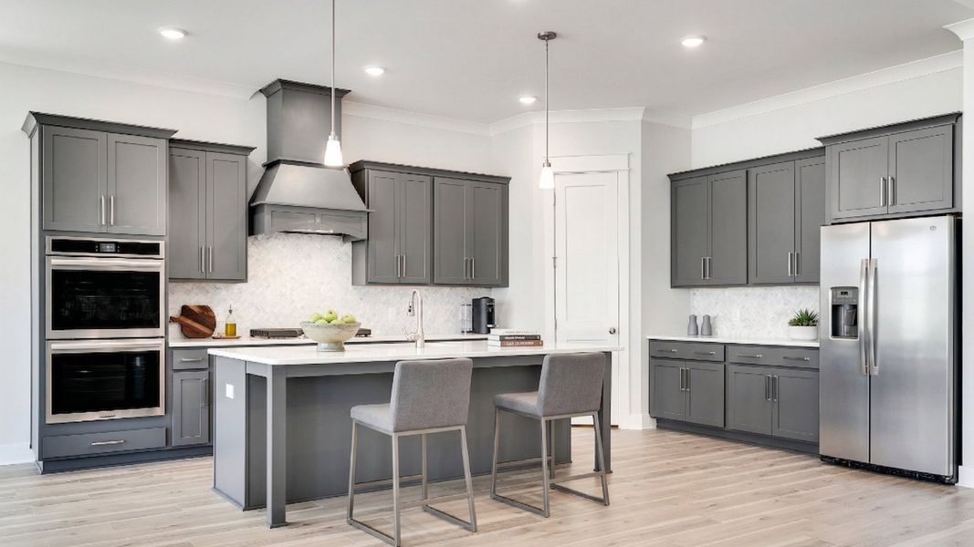 Virtually staged kitchen with gray cabinetry, quartz countertops, and tile backsplash