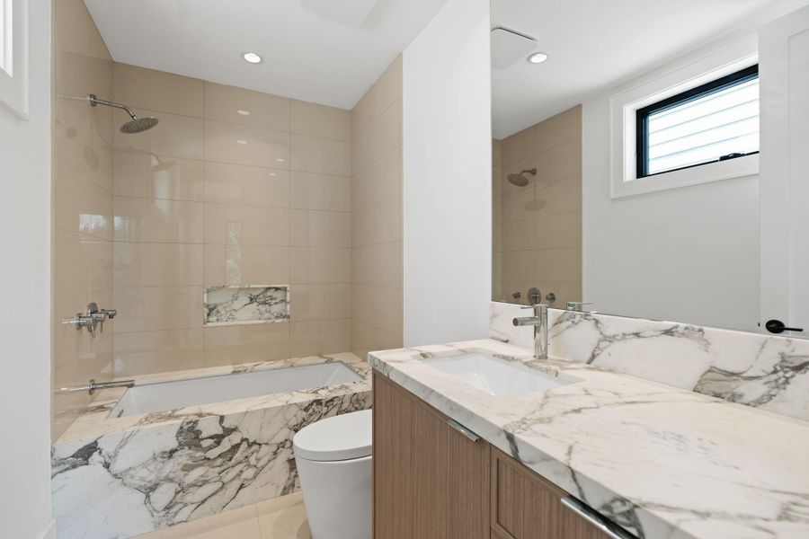 Guest bath with gorgeous stone accents.