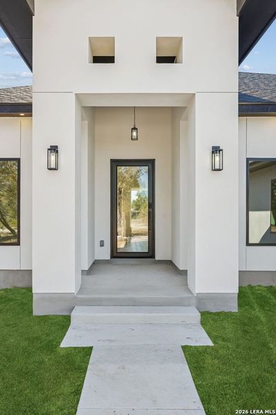 Exterior details and patio area of a home in , Spring Branch (Image 3).