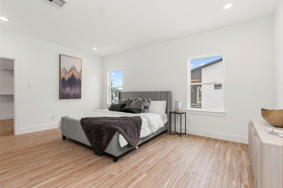Bright and spacious, this retreat features recessed lighting, double windows for natural light, and a generous walk-in closet for effortless organization