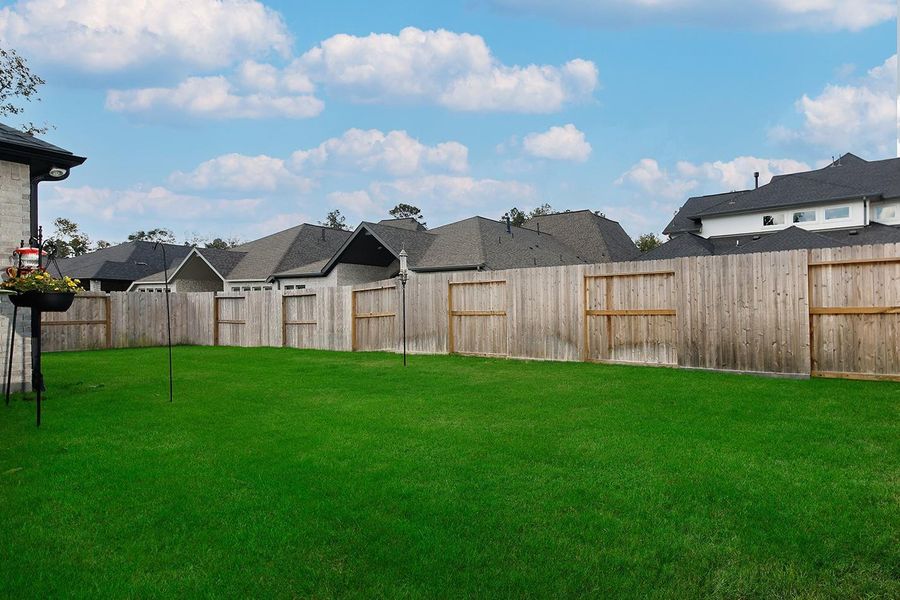 Exterior details and patio area of a home in The Highlands - 65', Porter (Image 22). Exterior details and patio area of a home in The Highlands - 65', Porter (Image 22).