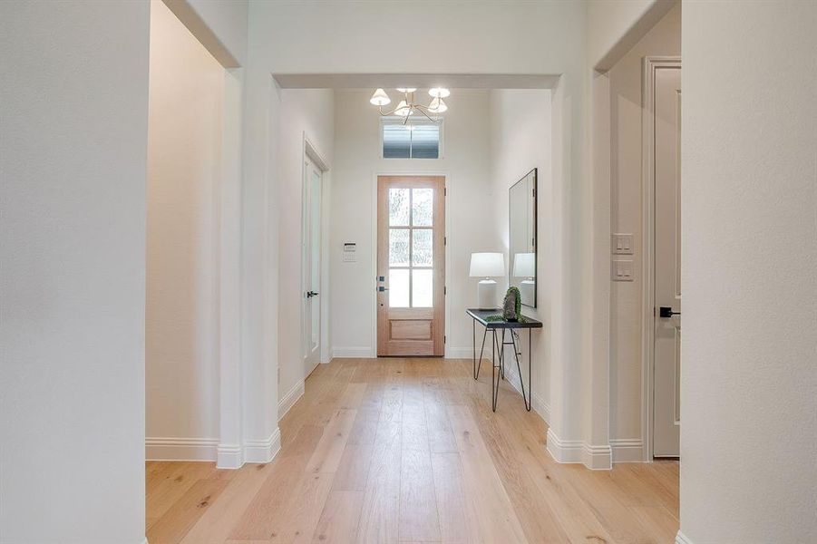 12 foot ceilings in the entry highlighted by a decorative chandelier. 12 foot ceilings in the entry highlighted by a decorative chandelier.