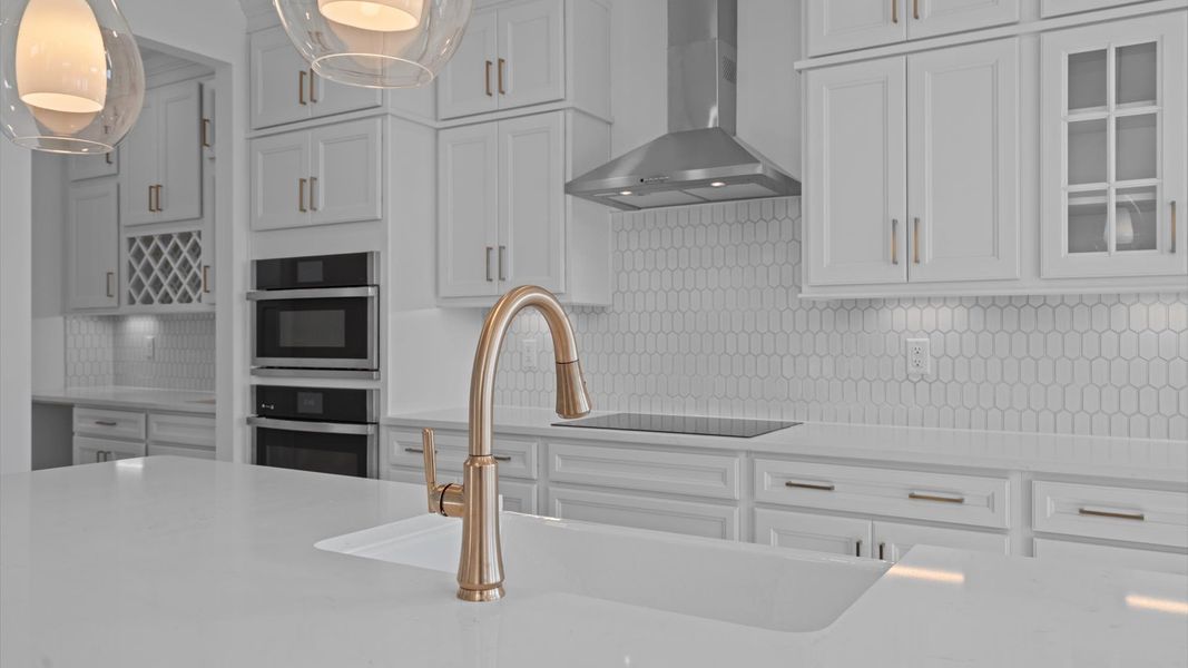 Vibrant kitchen layout with a center island, refined finishes, and open-concept flow