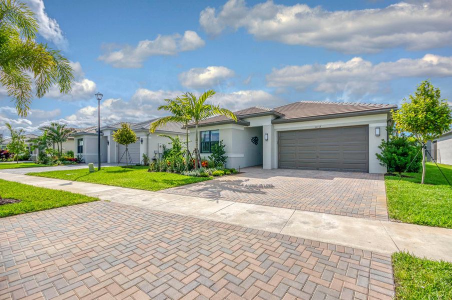 Front exterior of a new home in , Port St. Lucie, FL, highlighting curb appeal (Image 23).