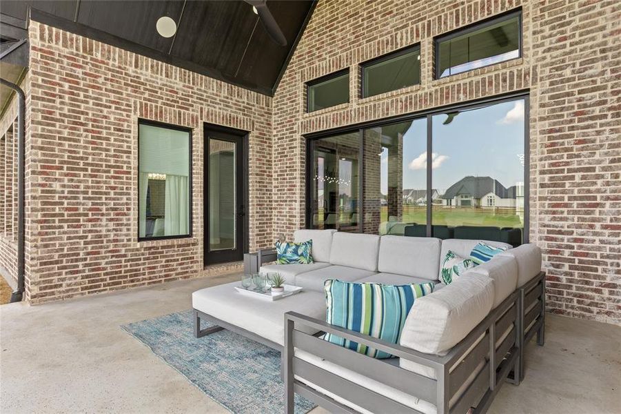 Modern inspired farmhouse featuring a metal roof, a standing seam roof, stone siding, and a porch