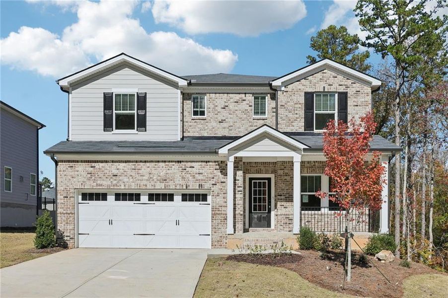 Front exterior of a new home in The Oaks at Dawson, Dawsonville, GA, highlighting curb appeal (Image 1).
