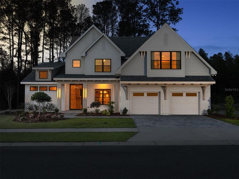 Front exterior of a new home in Laureate Village, Newberry, FL, highlighting curb appeal (Image 25). Front exterior of a new home in Laureate Village, Newberry, FL, highlighting curb appeal (Image 25).