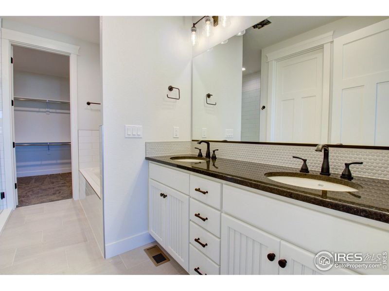 Notice the counter space and abundance of cabinetry on this double vanity