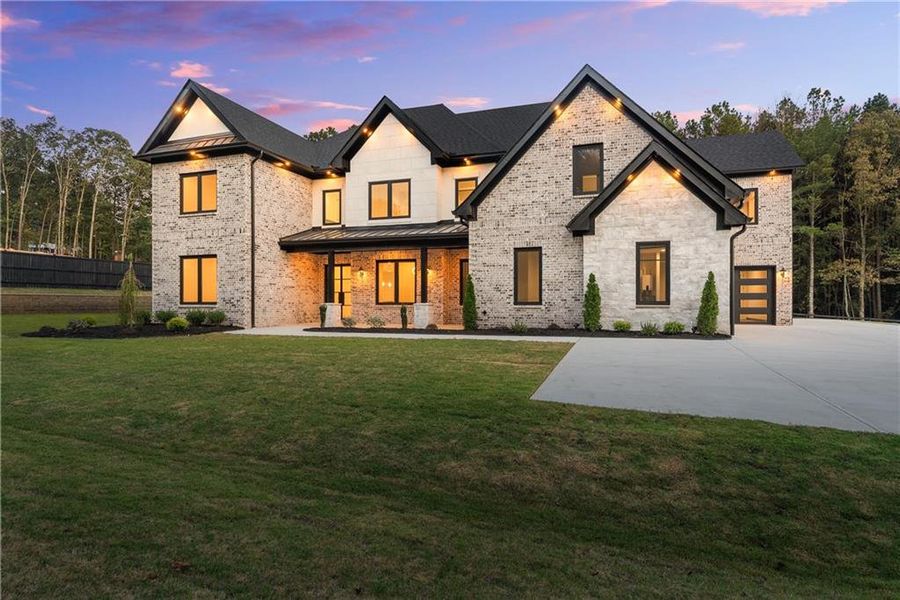 Front exterior of a new home in , Hoschton, GA, highlighting curb appeal (Image 30).