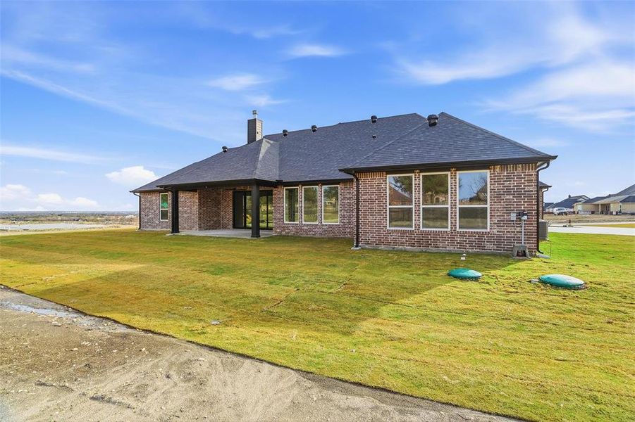 Exterior details and patio area of a home in Aledo Heights - Aledo ISD, Annetta South (Image 4).