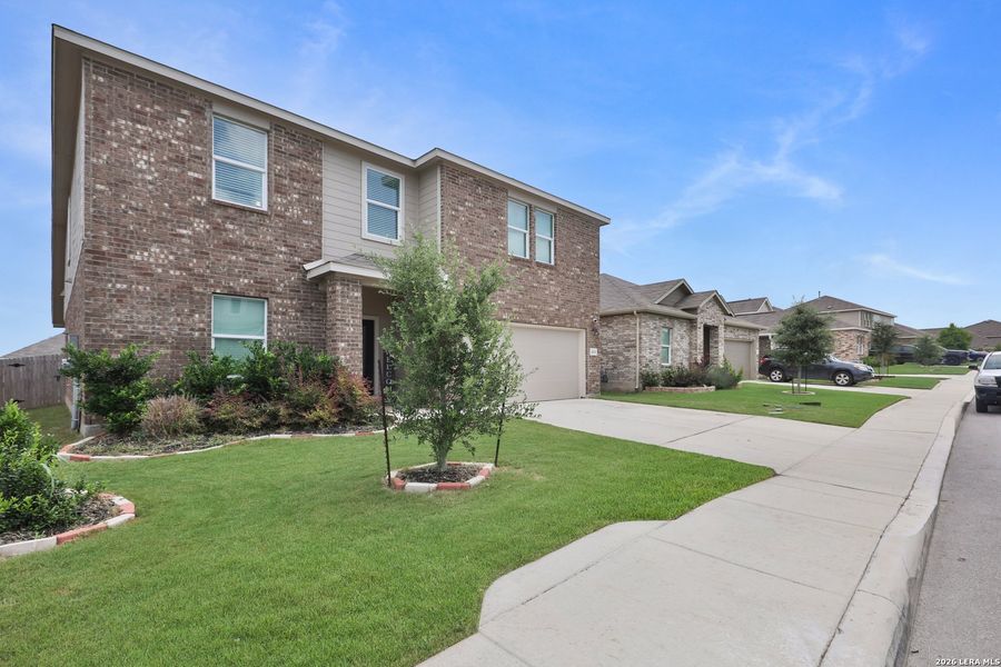 Front exterior of a new home in Brookmill, San Antonio, TX, highlighting curb appeal (Image 2). Front exterior of a new home in Brookmill, San Antonio, TX, highlighting curb appeal (Image 2).