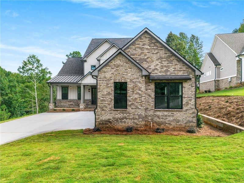 Front exterior of a new home in , Jefferson, GA, highlighting curb appeal (Image 24).