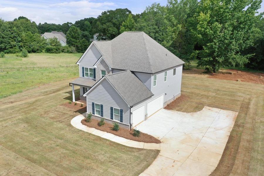 Front exterior of a new home in , McDonough, GA, highlighting curb appeal (Image 16).