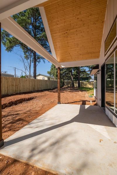 View of patio with a fenced backyard