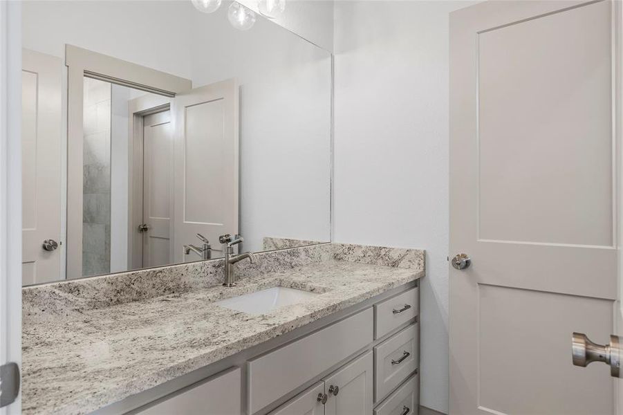 Jack and Jill bath between 2 secondary bedrooms - each with their own vanities