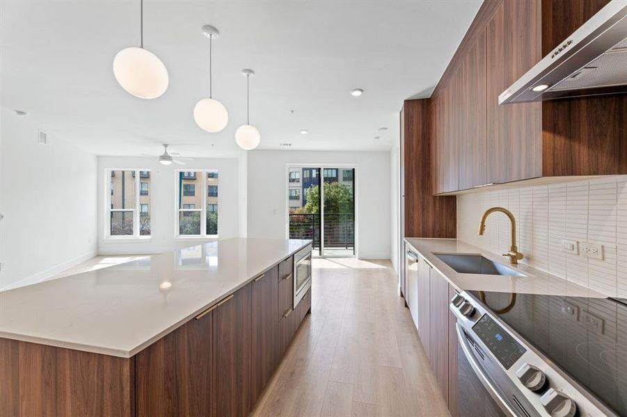 Stunning kitchen with expansive island and room for a dining table.