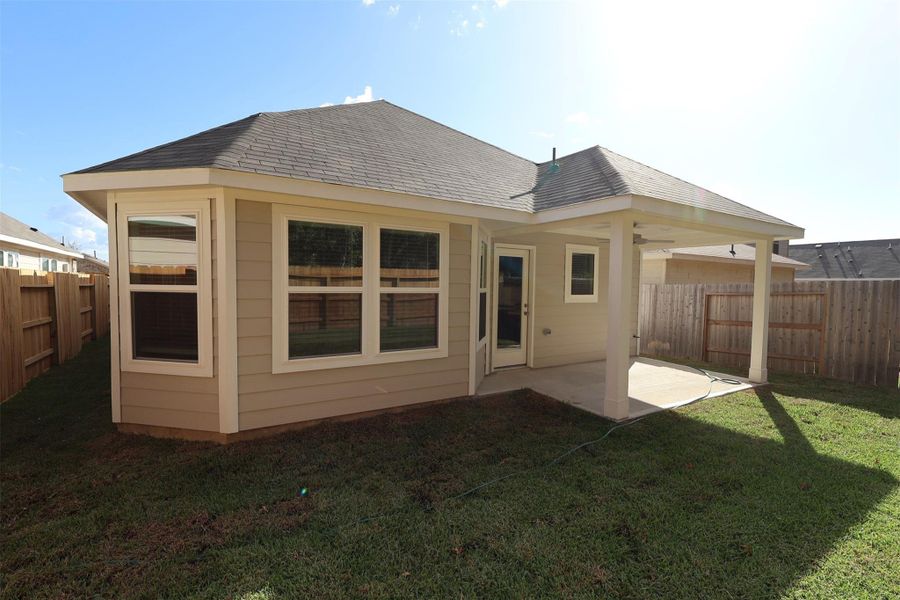Exterior details and patio area of a home in Pinewood at Grand Texas, New Caney (Image 3).