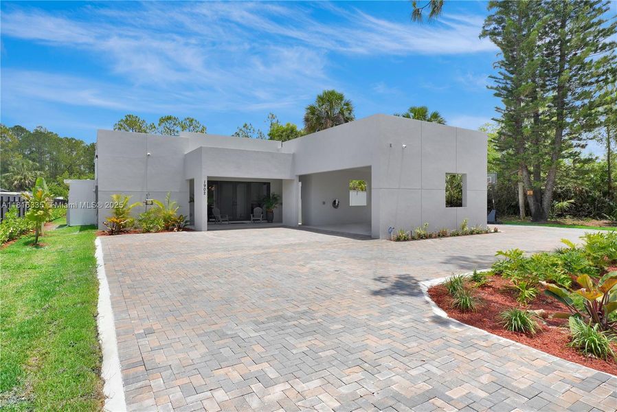 Front exterior of a new home in , Naples, FL, highlighting curb appeal (Image 16).