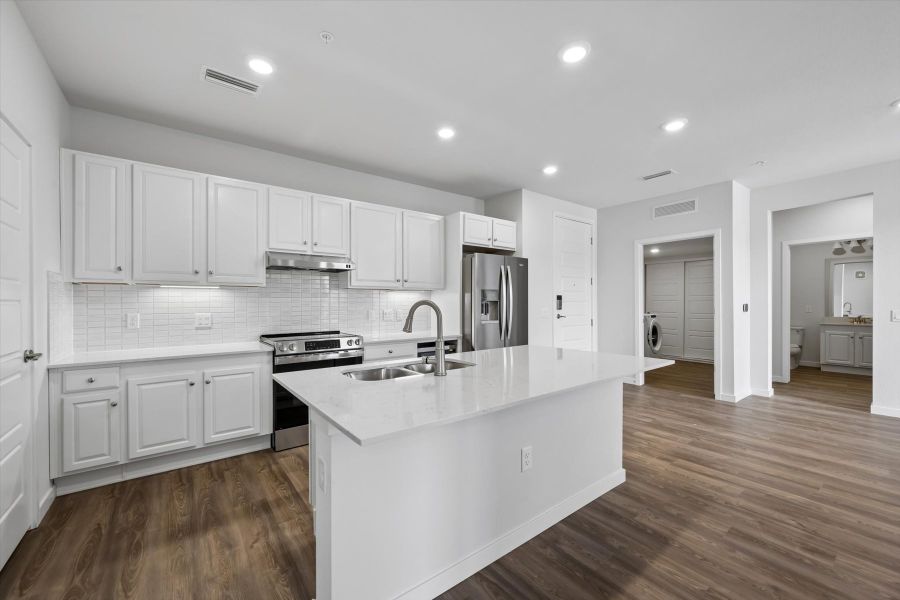 A kitchen with white cabinets. A kitchen with white cabinets.
