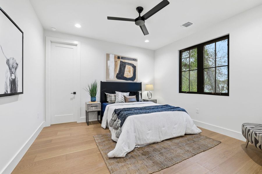 Bedroom featuring light wood-style flooring, recessed lighting, and a ceiling fan