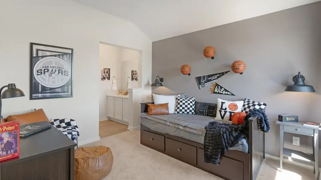 A well-lit bedroom features vaulted ceilings and plush carpet, perfect for comfortable living. A well-lit bedroom features vaulted ceilings and plush carpet, perfect for comfortable living.