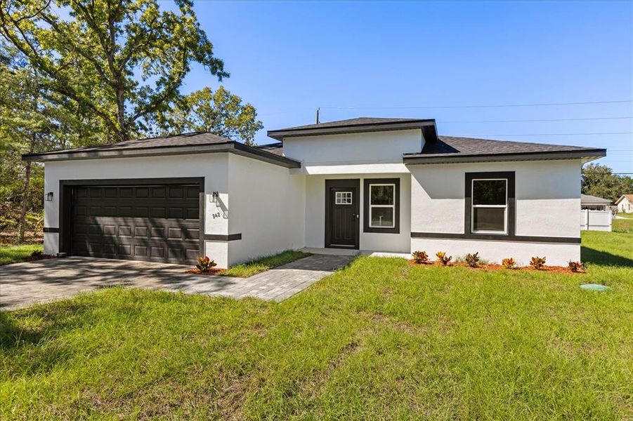 Front exterior of a new home in , Ocala, FL, highlighting curb appeal (Image 22).