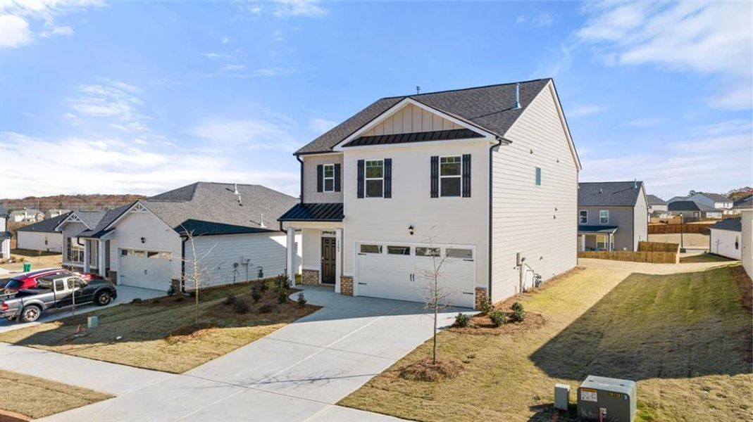 Front exterior of a new home in Shoal Creek, Hampton, GA, highlighting curb appeal (Image 2).