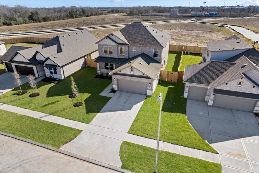 Front exterior of a new home in , Manvel, TX, highlighting curb appeal (Image 20).