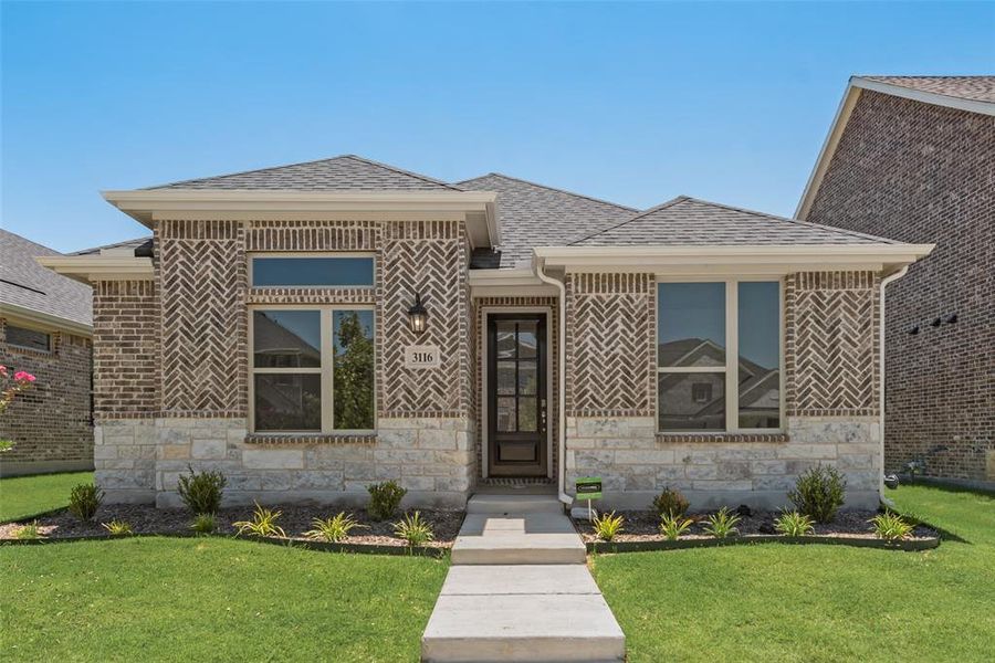 Front exterior of a new home in Arbors at Legacy Hills, Celina, TX, highlighting curb appeal (Image 13). Front exterior of a new home in Arbors at Legacy Hills, Celina, TX, highlighting curb appeal (Image 13).