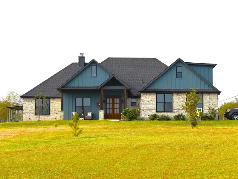 Front exterior of a new home in , Grandview, TX, highlighting curb appeal (Image 1). Front exterior of a new home in , Grandview, TX, highlighting curb appeal (Image 1).