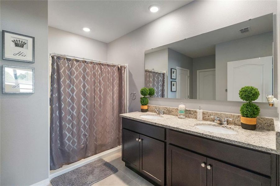 Primary Bathroom with Walk in Closet and Walk in Linen Closet