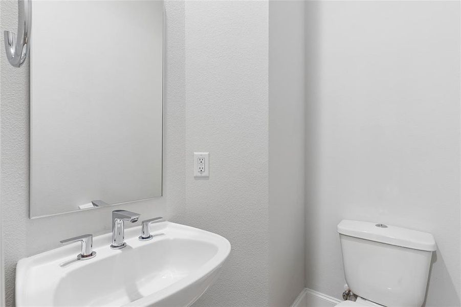 Image of model home with similar floorplan.