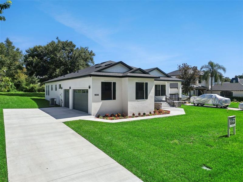 Front exterior of a new home in , Clermont, FL, highlighting curb appeal (Image 27).
