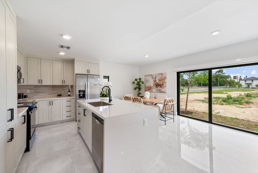 Representative furnished interior of a home built from the Model E by Onx Homes in On Alba, Florida City (Image 35).