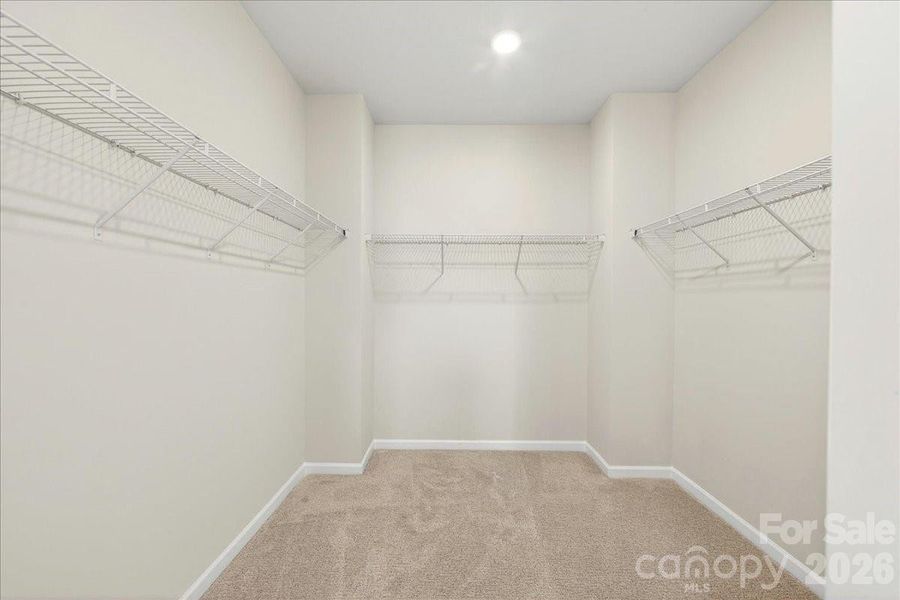 Primary walk-in closet Primary walk-in closet