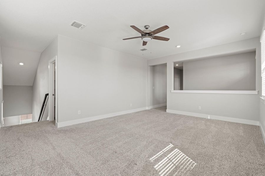 Unfurnished room featuring recessed lighting, light colored carpet, and a ceiling fan Unfurnished room featuring recessed lighting, light colored carpet, and a ceiling fan