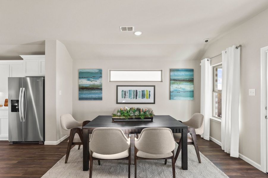 Dining room in the Heisman home plan by Trophy Signature Homes – REPRESENTATIVE PHOTO