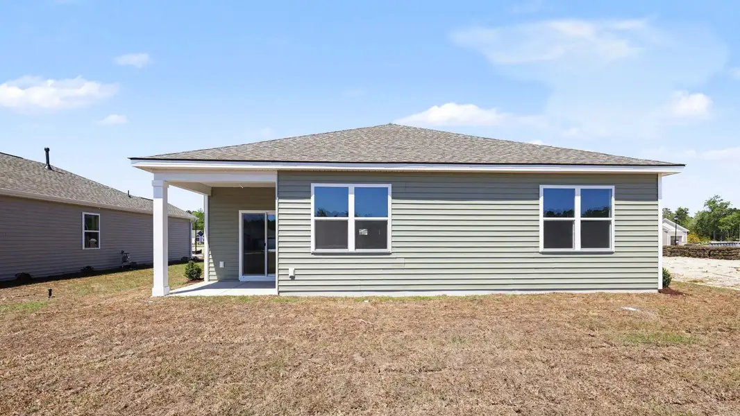 Exterior details and patio area of a home in Sandridge Park, Little River (Image 3).
