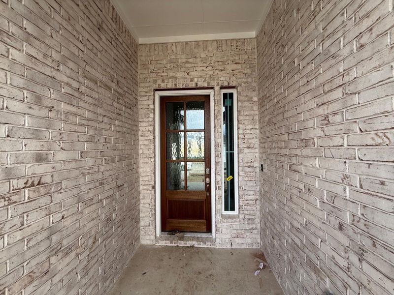Entrance to property featuring brick siding Entrance to property featuring brick siding