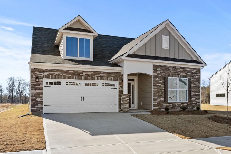 Front exterior of a new home in Founders Club, Moore, SC, highlighting curb appeal (Image 2). Front exterior of a new home in Founders Club, Moore, SC, highlighting curb appeal (Image 2).