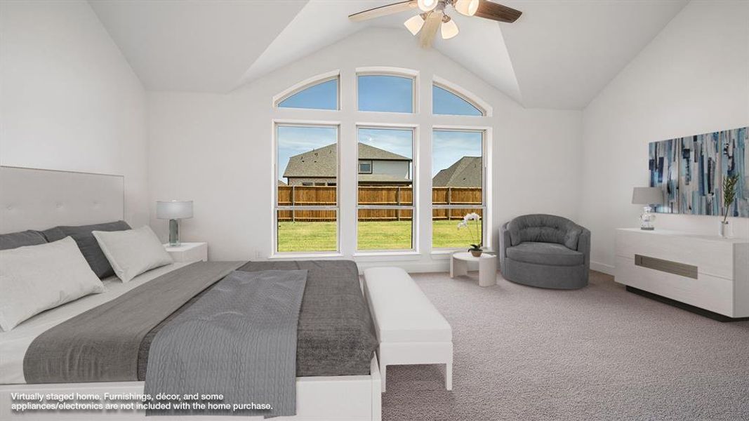 Bedroom featuring carpet floors, ceiling fan, and high vaulted ceiling