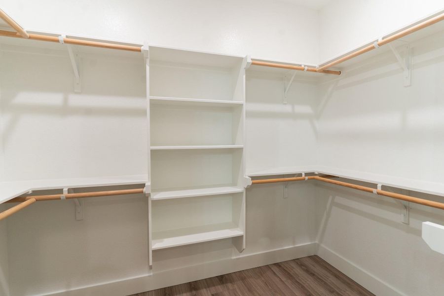 Spacious closet with wood finished floors