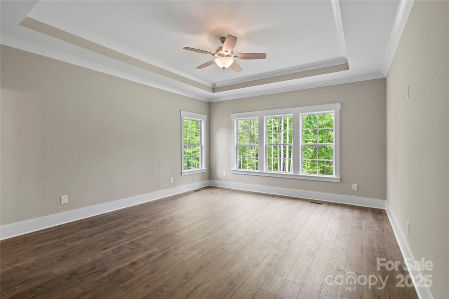 Main floor master bedroom with his-&-hers walk-in closets Main floor master bedroom with his-&-hers walk-in closets
