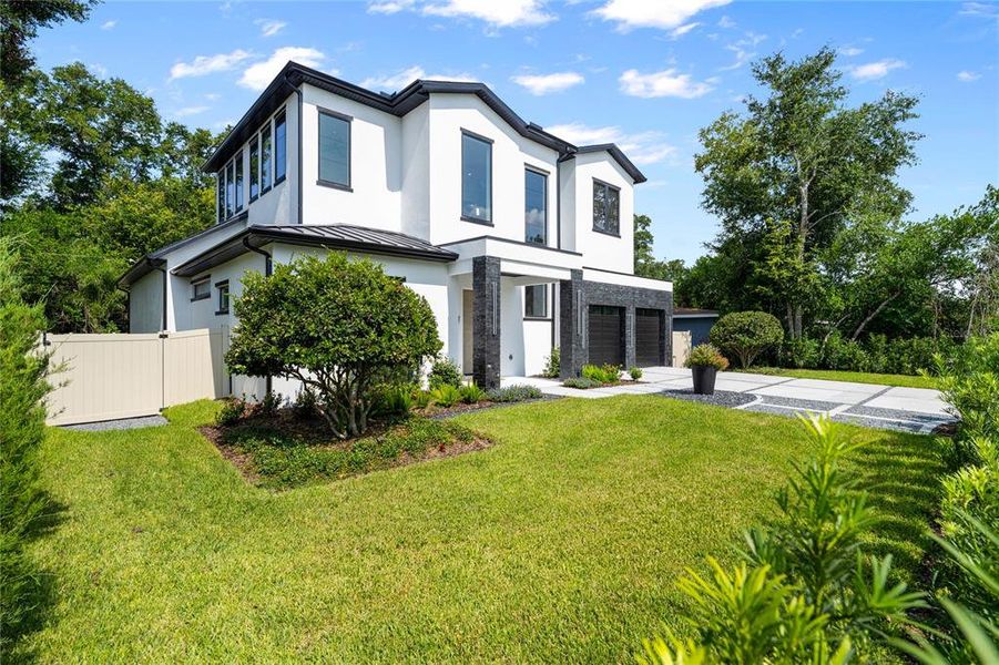 Front exterior of a new home in , Winter Park, FL, highlighting curb appeal (Image 22). Front exterior of a new home in , Winter Park, FL, highlighting curb appeal (Image 22).