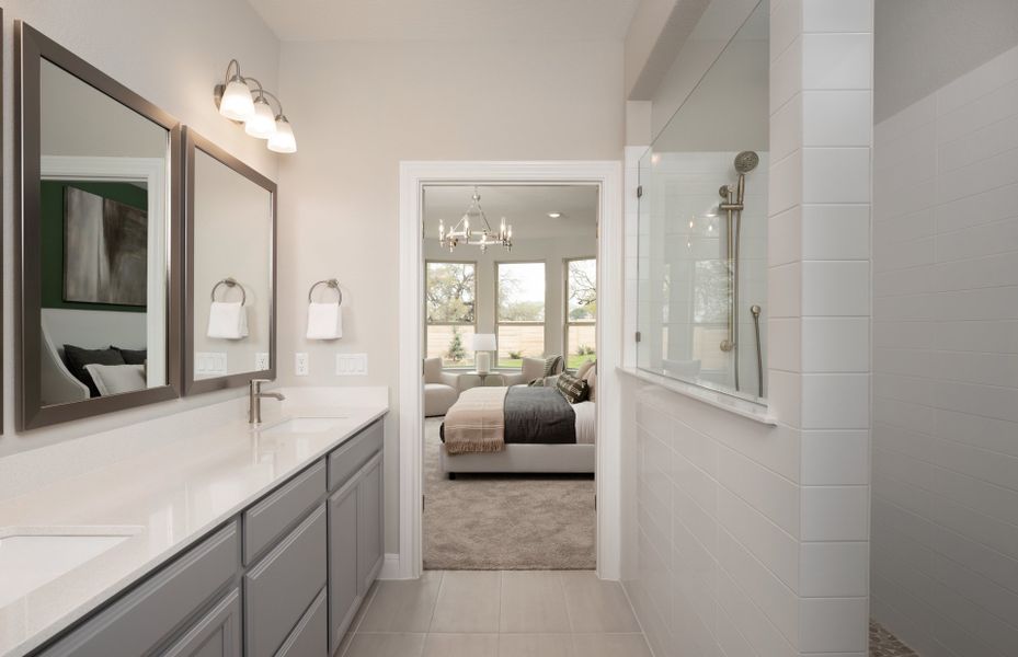 Owner's bathroom with double vanity, tile floors a