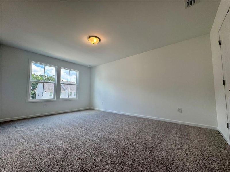Spacious, unfurnished interior of a new home in Eastlyn Crossing - Single Family, Flowery Branch (Image 46). Spacious, unfurnished interior of a new home in Eastlyn Crossing - Single Family, Flowery Branch (Image 46).