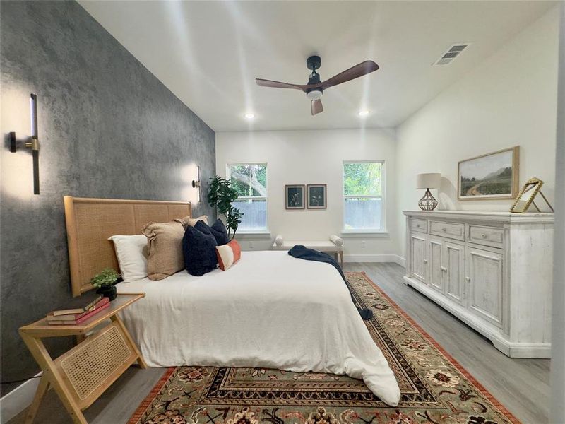 Bedroom featuring ceiling fan and light hardwood / wood-style floors